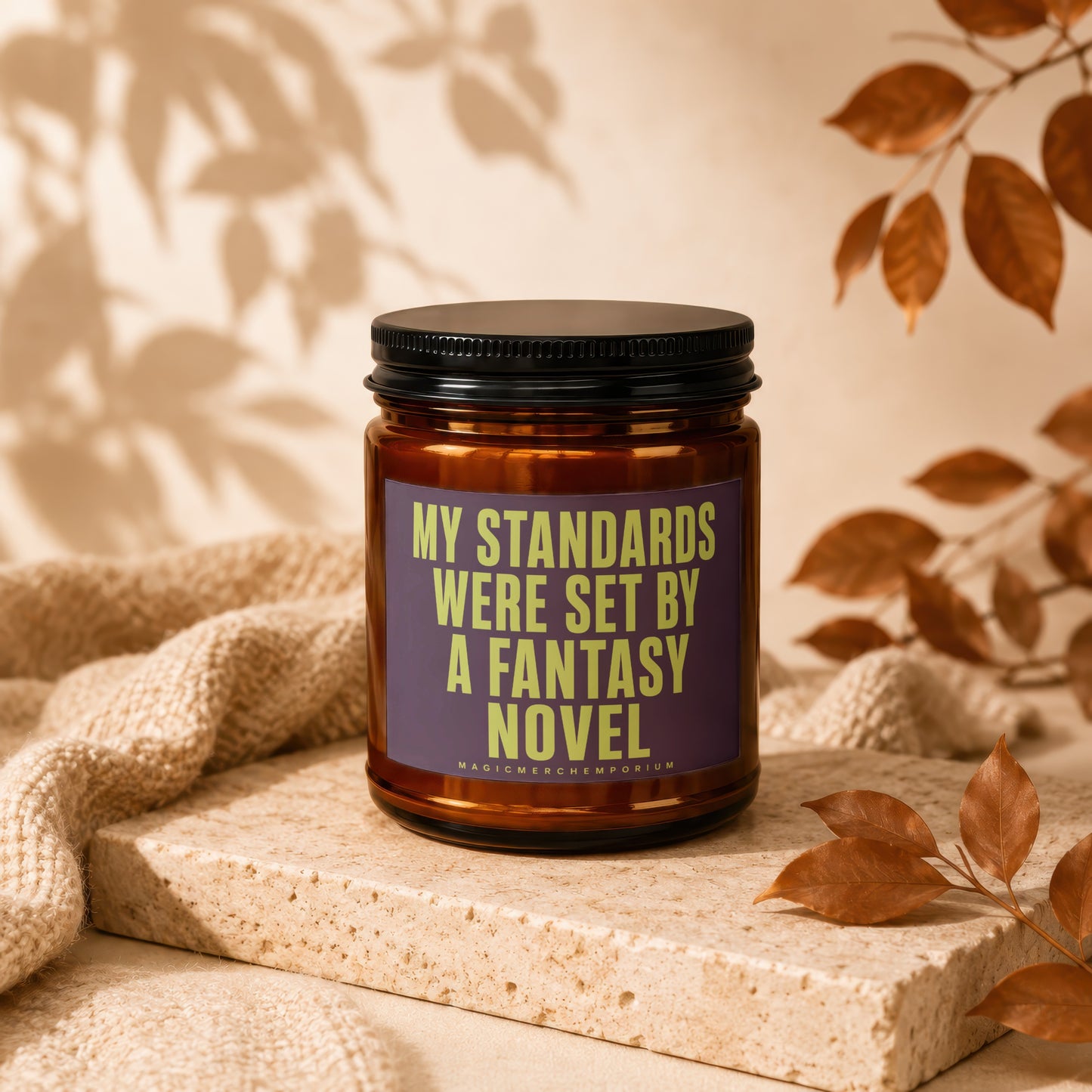 Candle with text "MY STANDARDS WERE SET BY A FANTASY NOVEL" and "MAGICMERCHEMPORIUM".