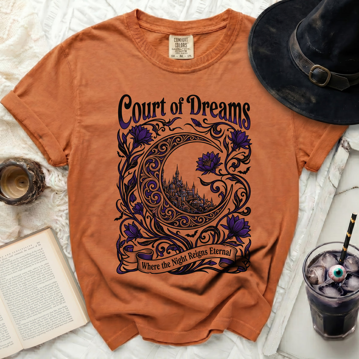 Orange Comfort Colors t-shirt with "Court of Dreams" and moon castle design.