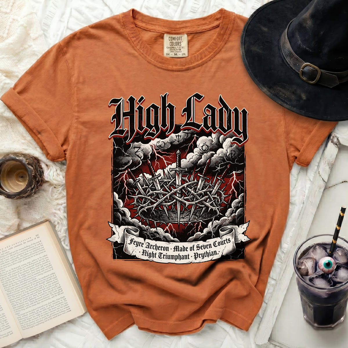 Orange shirt with "High Lady" text and sword imagery.