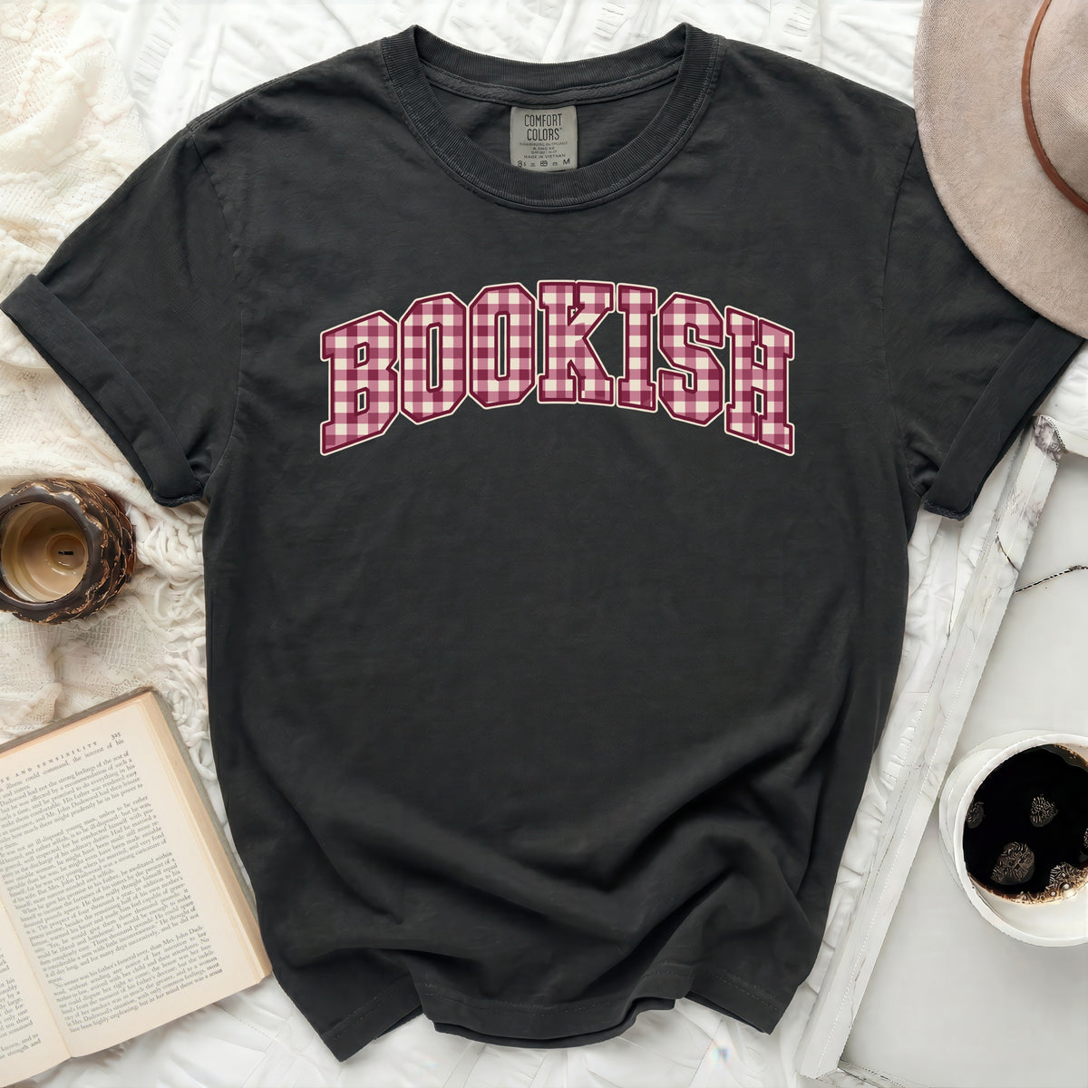 Dark grey t-shirt with "BOOKISH" in red gingham lettering.