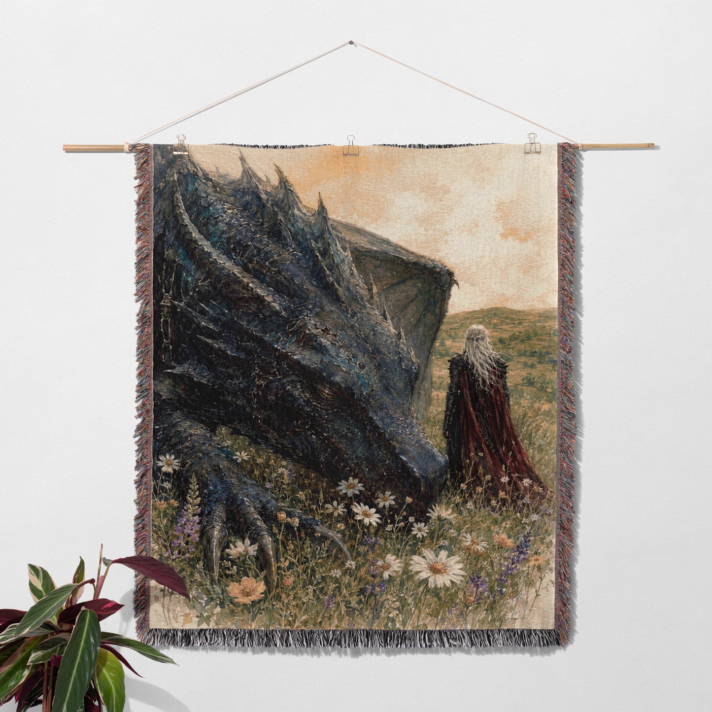 a large dragon with a long neck and sharp teeth, standing in a field of flowers and grass. A person wearing a red cape is standing next to the dragon.