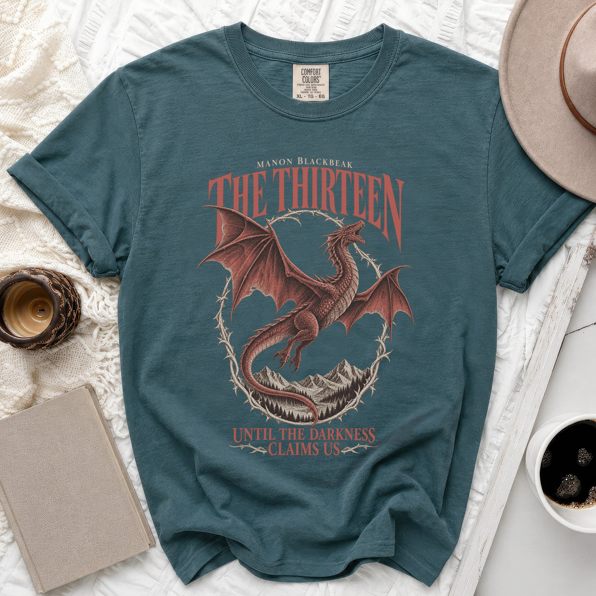 Teal t-shirt with red dragon and text "Manon Blackbeak The Thirteen Until the Darkness Claims Us".