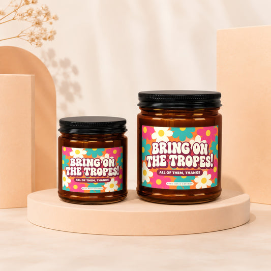 Two amber jars with black lids, featuring floral labels that read "BRING ON THE TROPES!".
