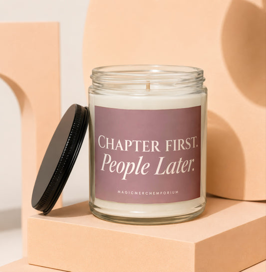 Glass candle with "Chapter First. People Later." text on label, black lid on side.