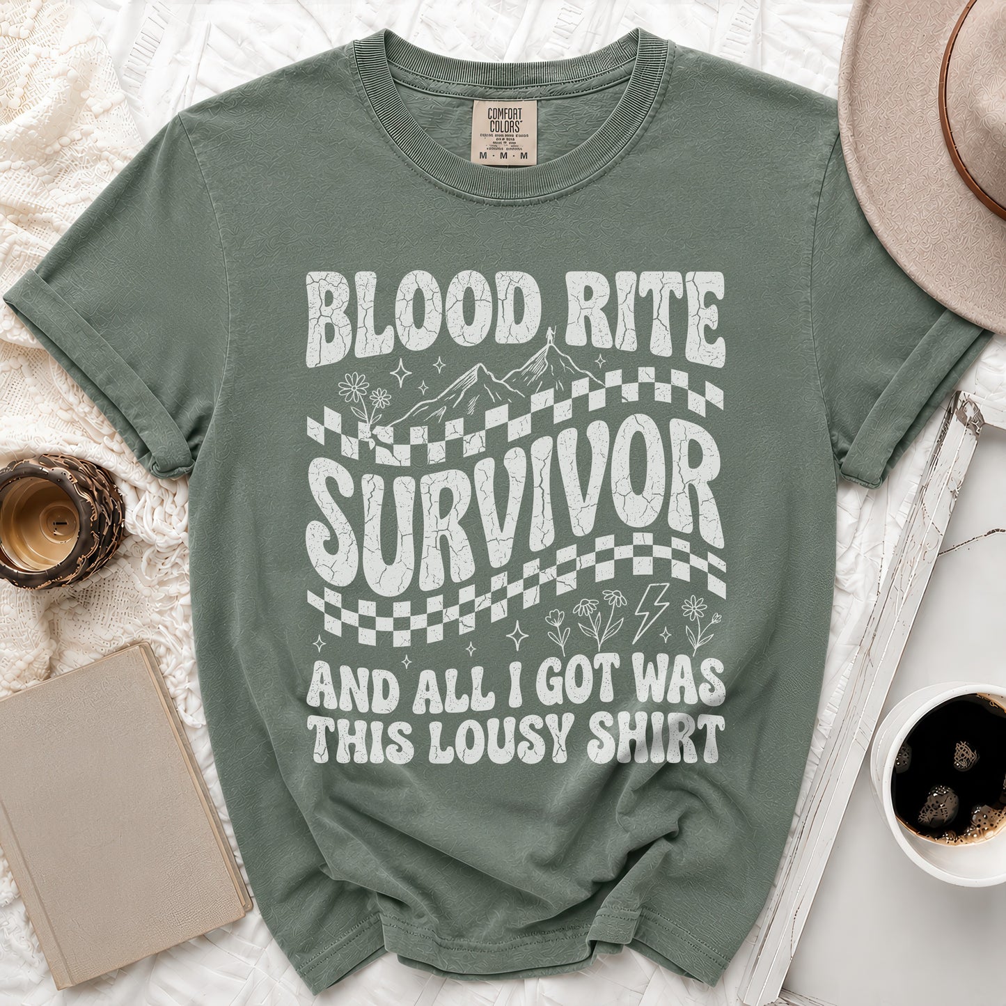 Green t-shirt with "Blood Rite Survivor And All I Got Was This Lousy Shirt" text.