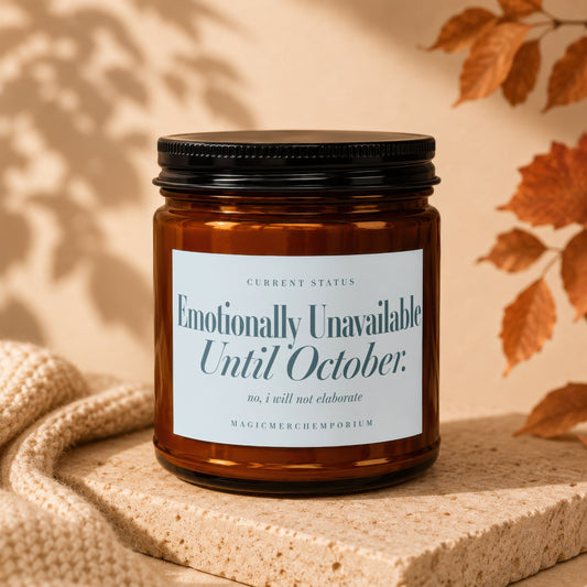 Amber jar candle with a label reading "Emotionally Unavailable Until October."