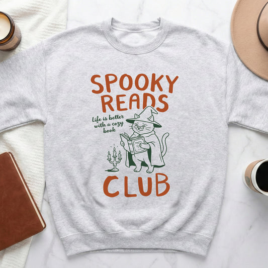 Light gray sweatshirt with "Spooky Reads Club" text and a cat in a witch hat reading.