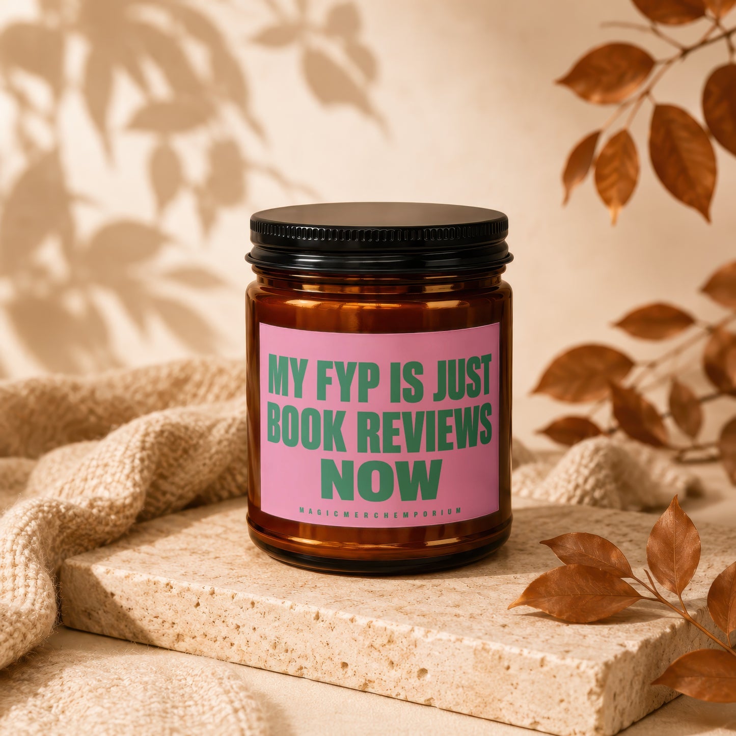 Amber candle with pink label reading "MY FYP IS JUST BOOK REVIEWS NOW".