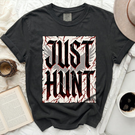 Black t-shirt with "JUST HUNT" in large gothic font and wings.