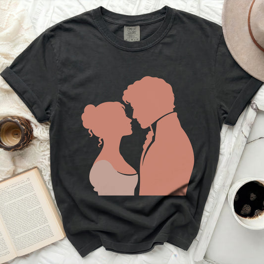Black t-shirt with silhouette of a couple in coral pink.