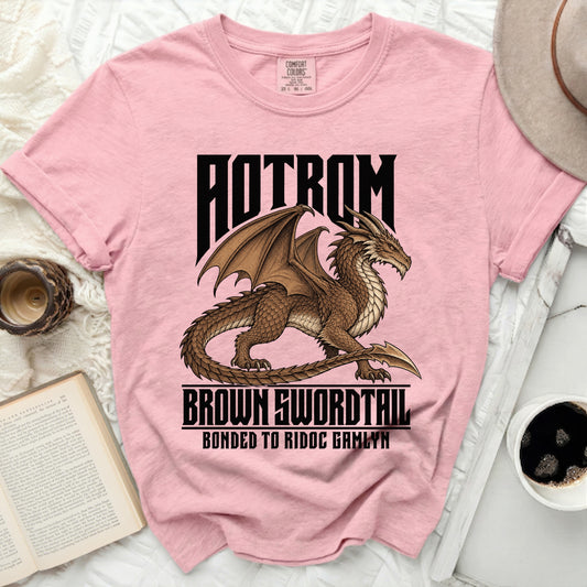 Pink t-shirt with brown dragon graphic and text "AOTROM BROWN SWORDTAIL BONDED TO RIDOC GAMLYN".
