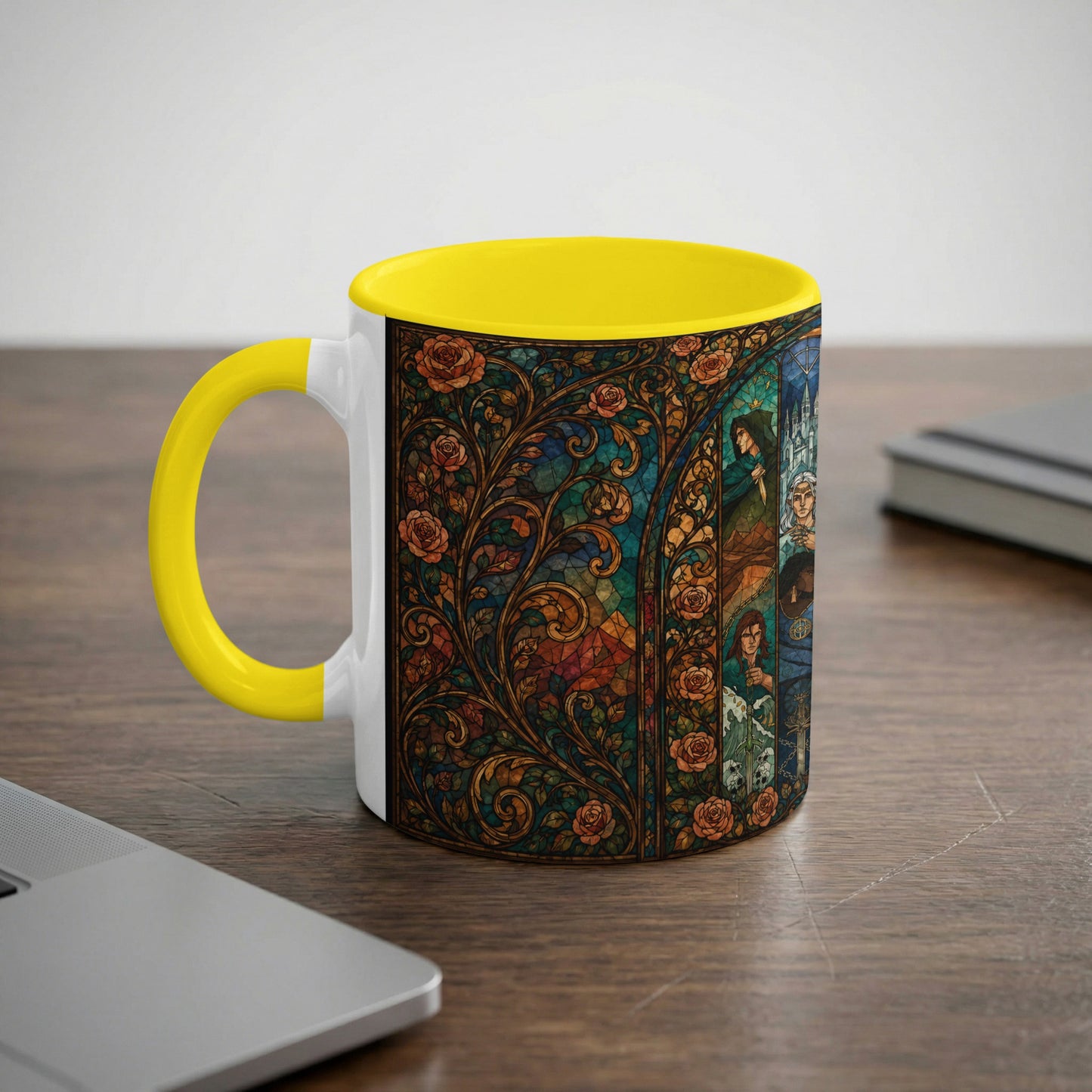 White mug with yellow handle featuring a stained-glass art design of roses and figures.