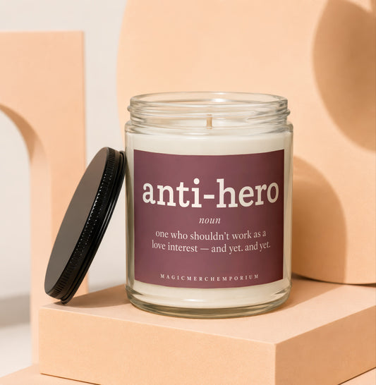 Glass candle with "anti-hero" label and definition.