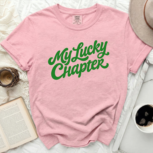 Pink t-shirt with green text that reads "My Lucky Chapter".