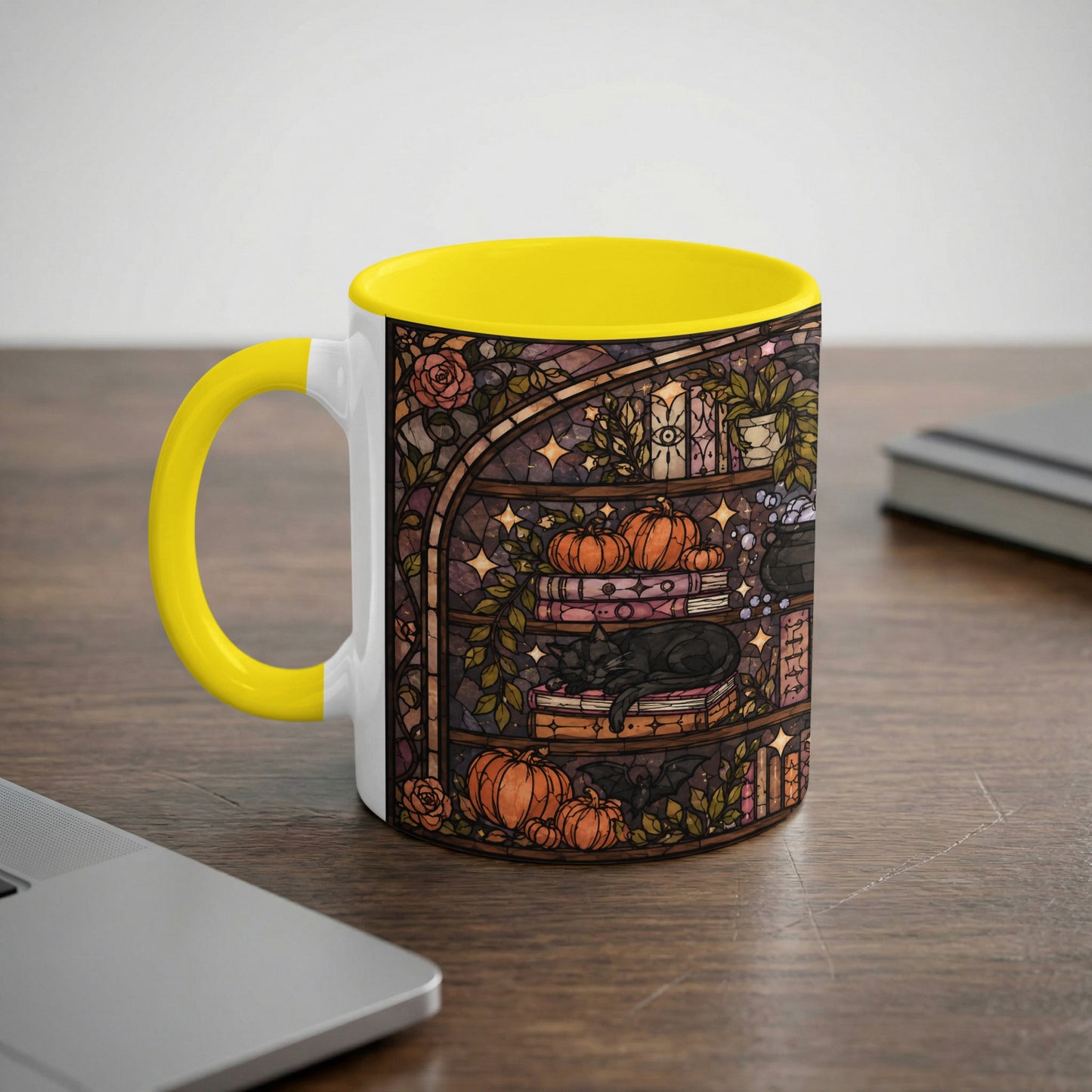 Mug with yellow handle featuring stained glass art of a black cat sleeping on books and pumpkins.