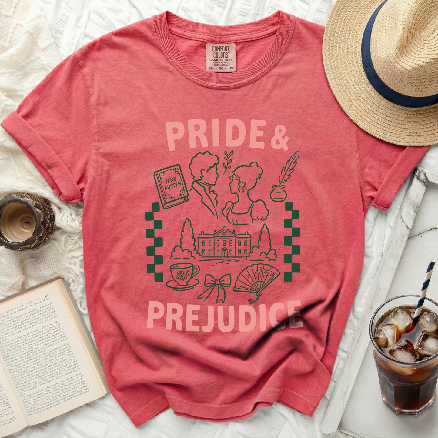 Coral t-shirt with "Pride & Prejudice" Jane Austen graphic featuring book, couple, and house.