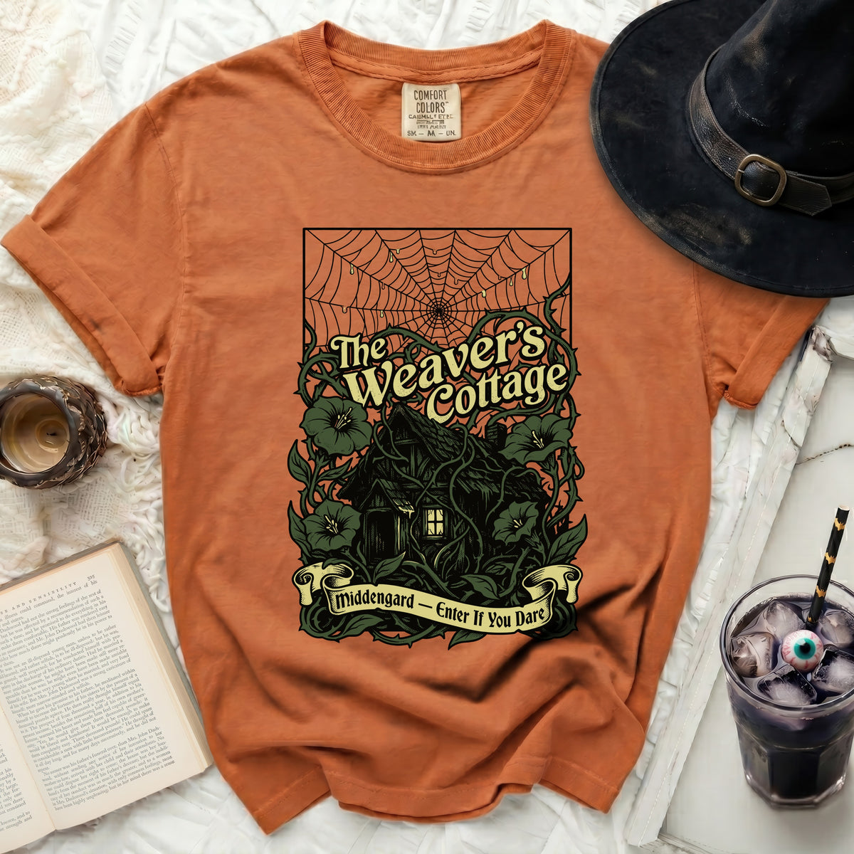 Orange t-shirt with "The Weaver's Cottage" and "Middengard - Enter If You Dare" text.