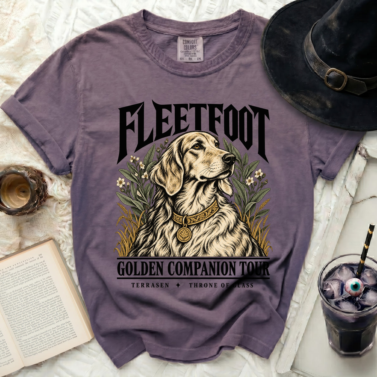 Purple t-shirt with "FLEETFOOT GOLDEN COMPANION TOUR" and dog illustration.