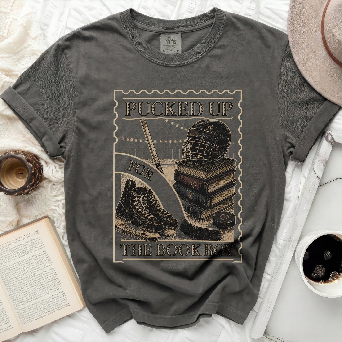 Dark t-shirt with "Pucked Up for the Book Boy" text and hockey imagery.
