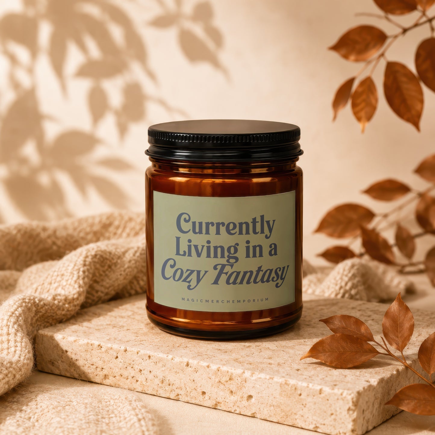 Amber jar candle with text "Currently Living in a Cozy Fantasy".