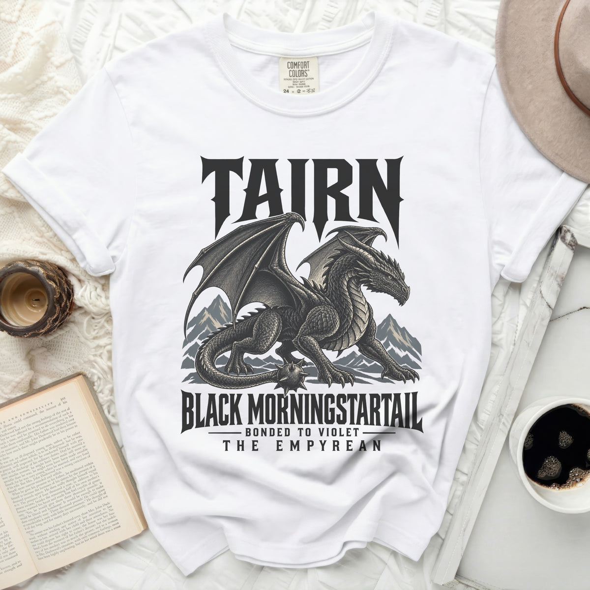 White t-shirt with black dragon graphic and text "TAIRN", "BLACK MORNINGSTARTAIL", "BONDED TO VIOLET", "THE EMPYREAN".