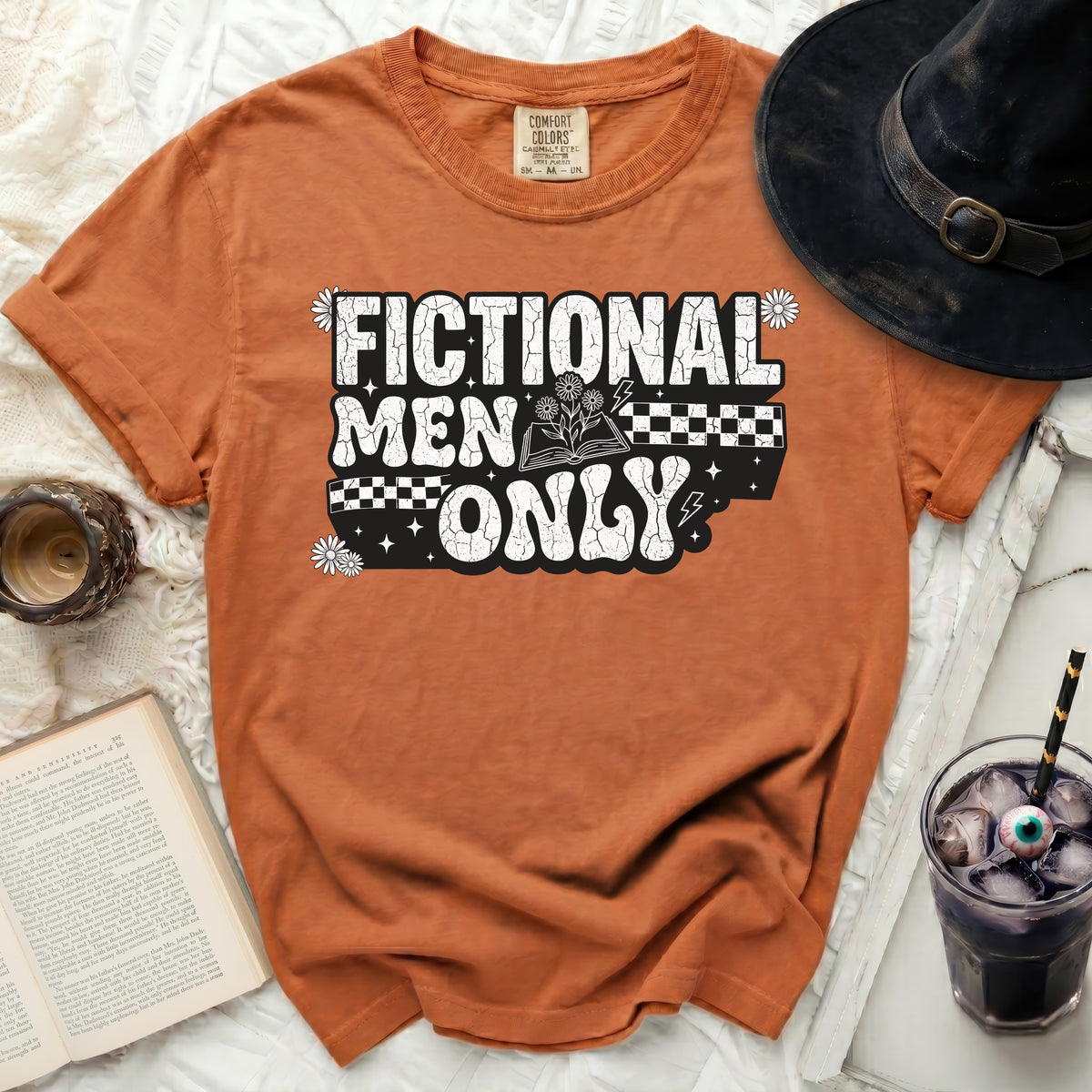 Orange t-shirt with "Fictional Men Only" graphic and an open book.