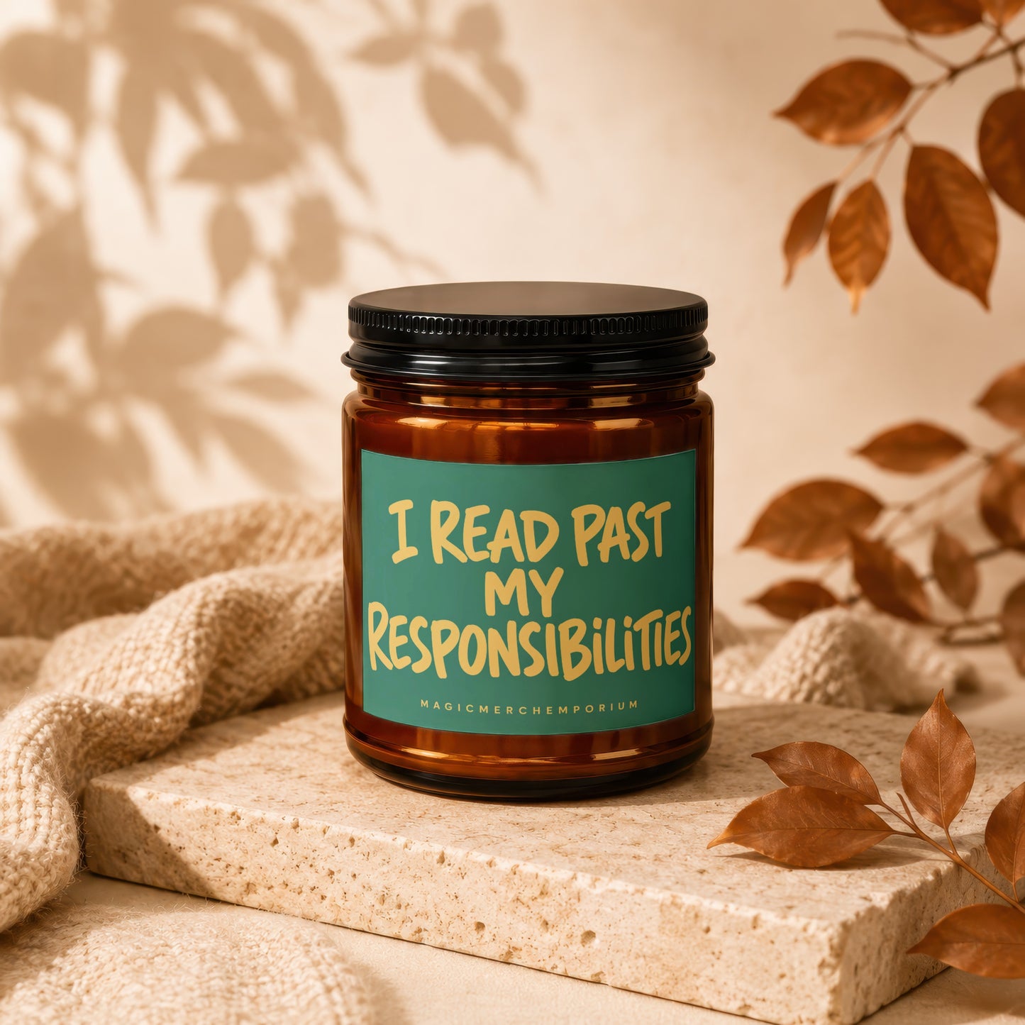 Amber jar candle with "I READ PAST MY RESPONSIBILITIES" text on a teal label.
