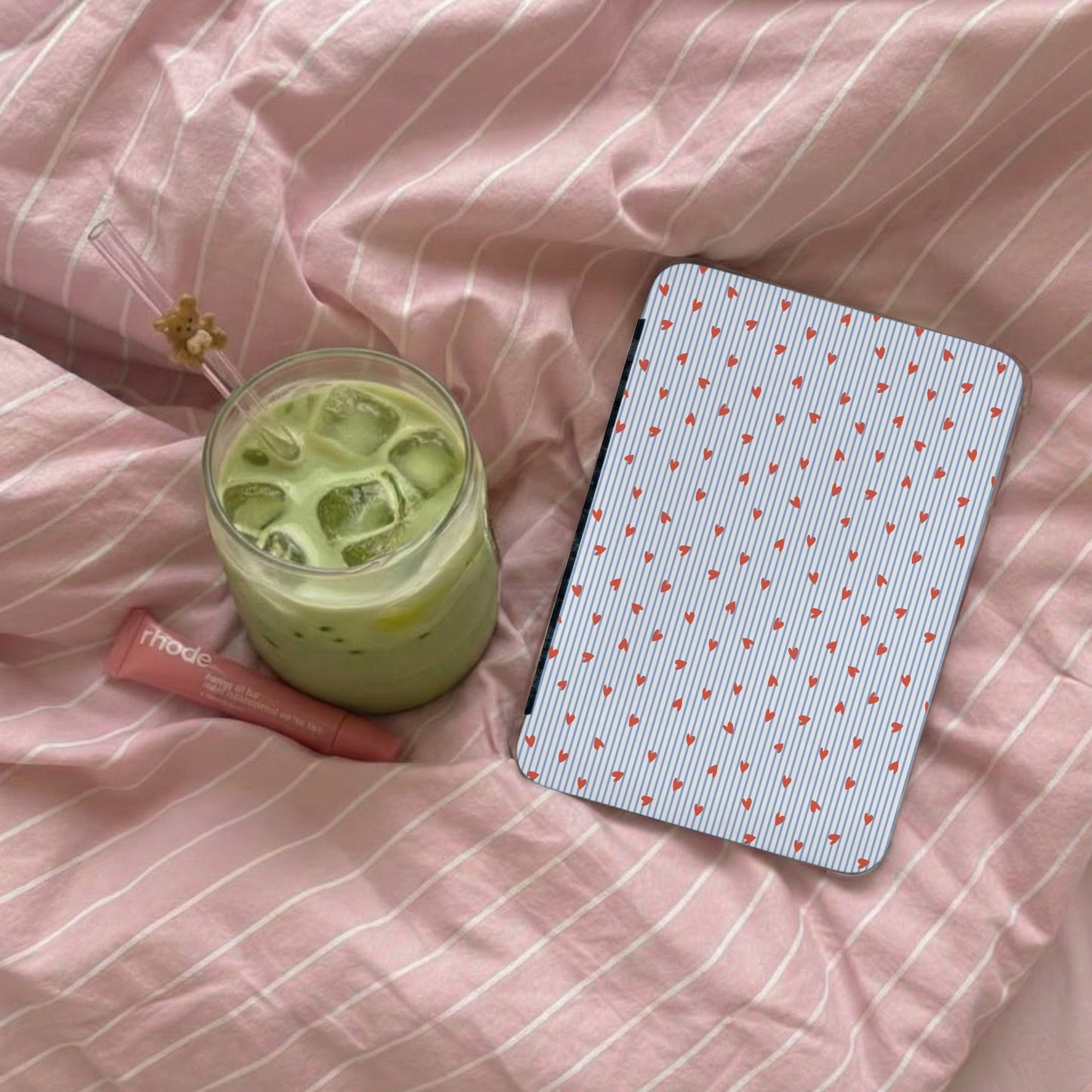 Iced Matcha Latte with Pink Bedding Background Scene