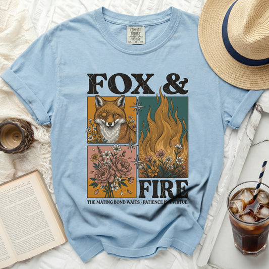 Light blue t-shirt with "Fox & Fire" graphic and text.