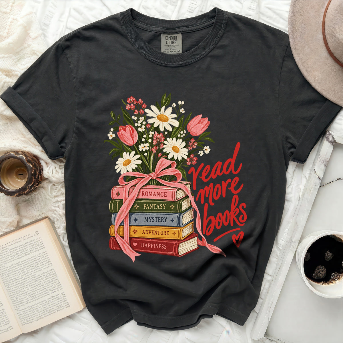 Dark t-shirt with floral bouquet over stacked books reading "Read More Books".