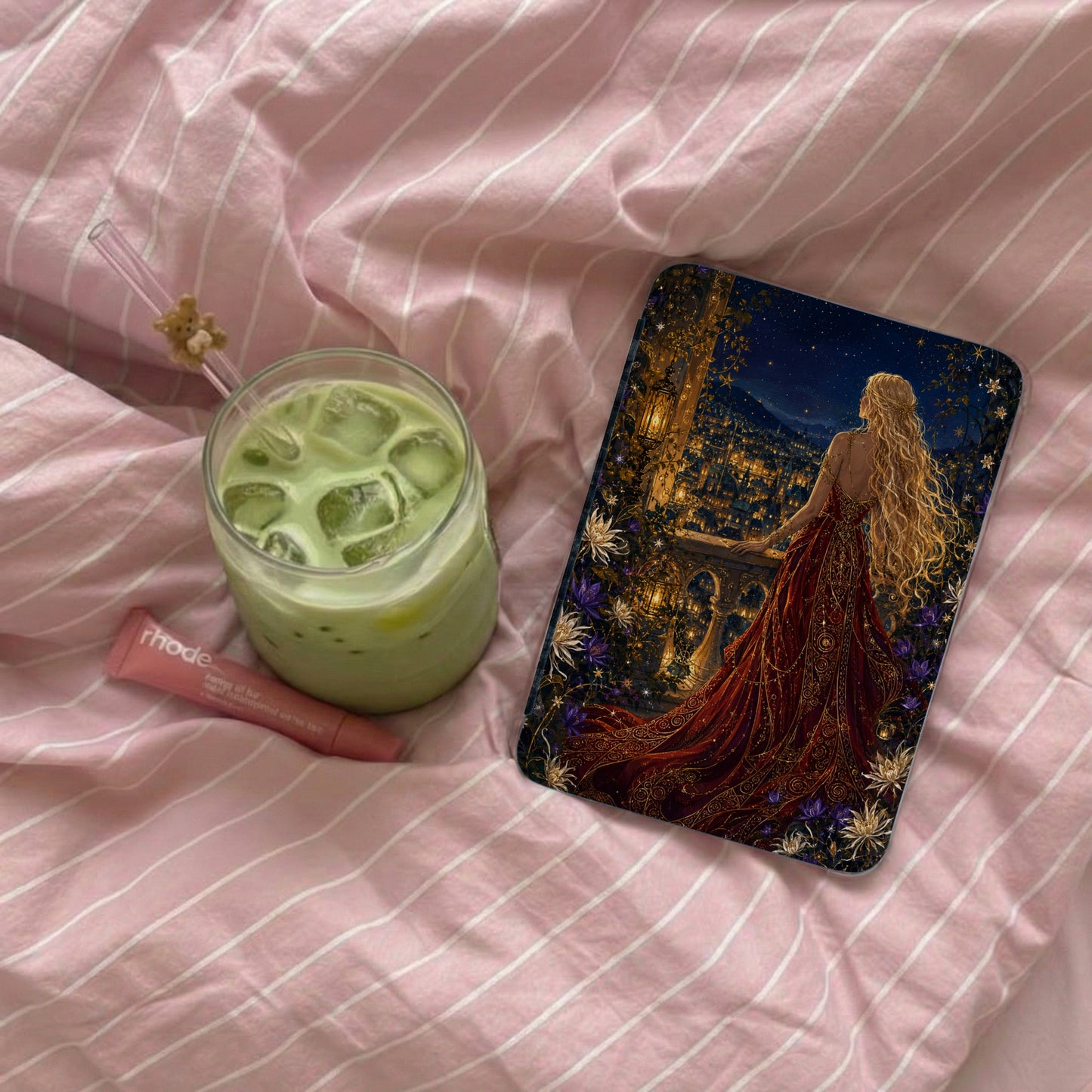 Phone case featuring a woman in a red dress overlooking a starry city from a balcony.