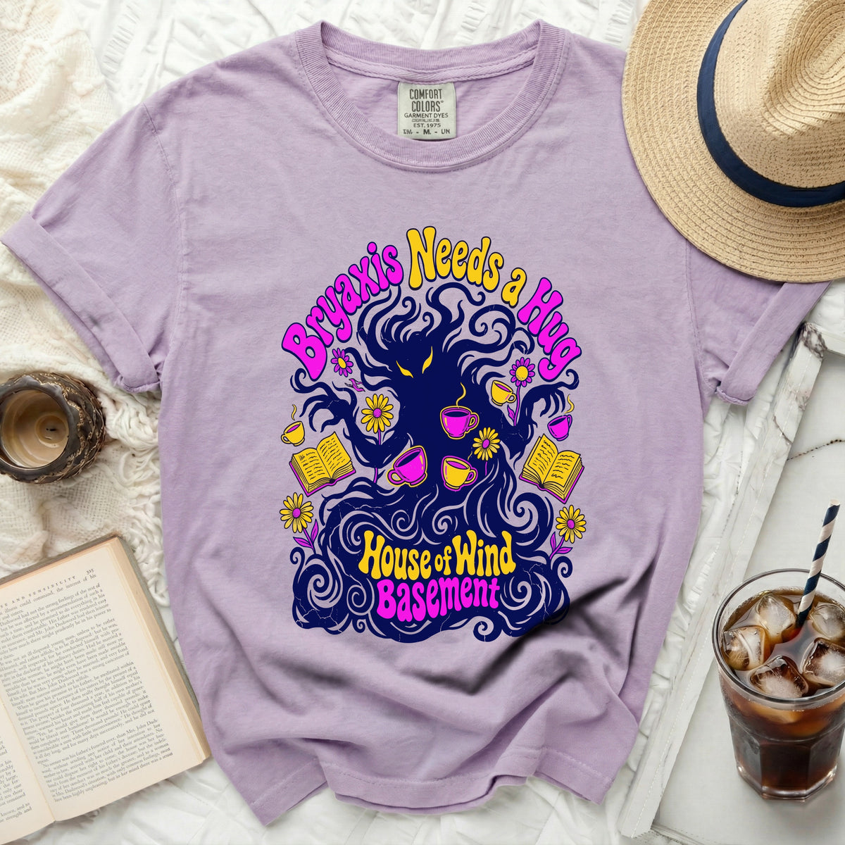 Purple t-shirt with "Bryaxis Needs a Hug" and "House of Wind Basement" text graphic.