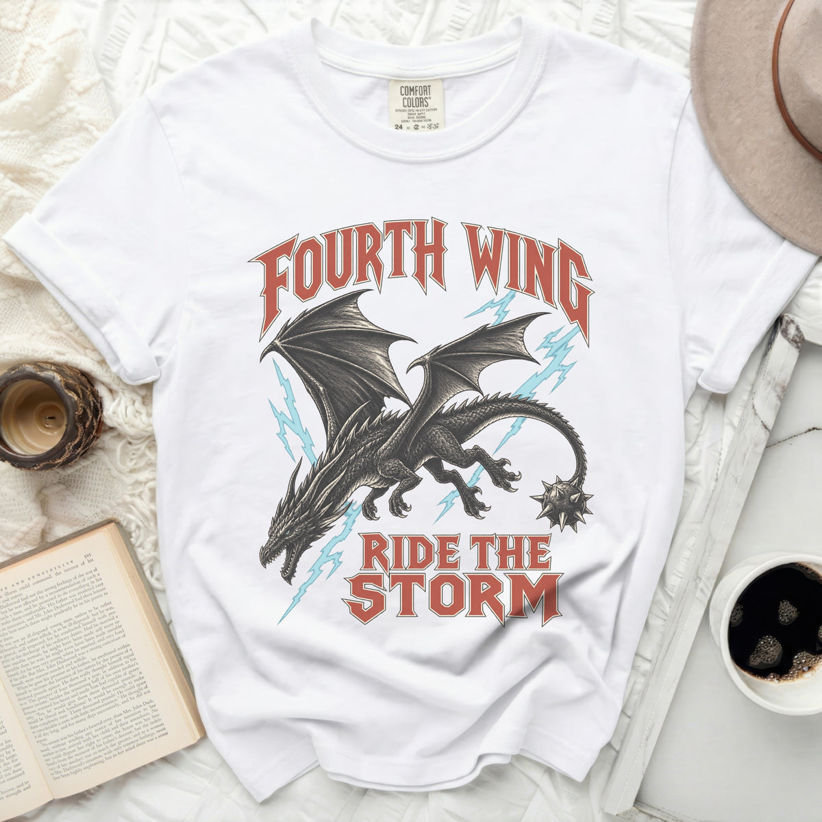White t-shirt with "Fourth Wing Ride The Storm" text and a dragon graphic.