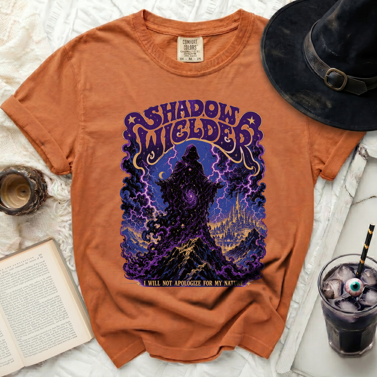 Orange t-shirt with "Shadow Wielder" design and quote.