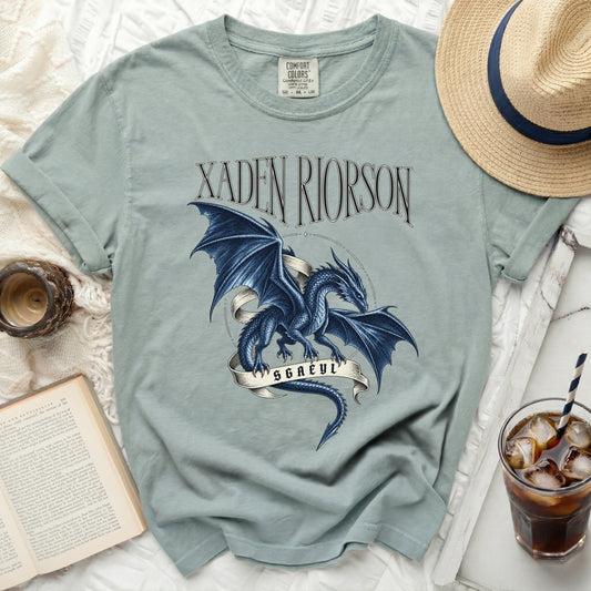 Light blue t-shirt with a blue dragon and "XADEN RIORSON SGAEYL" text.
