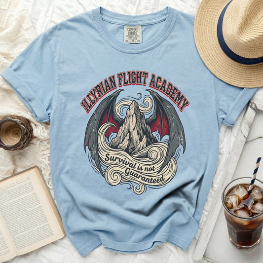 Light blue t-shirt with "Illyrian Flight Academy" graphic and "Survival is not Guaranteed" text.
