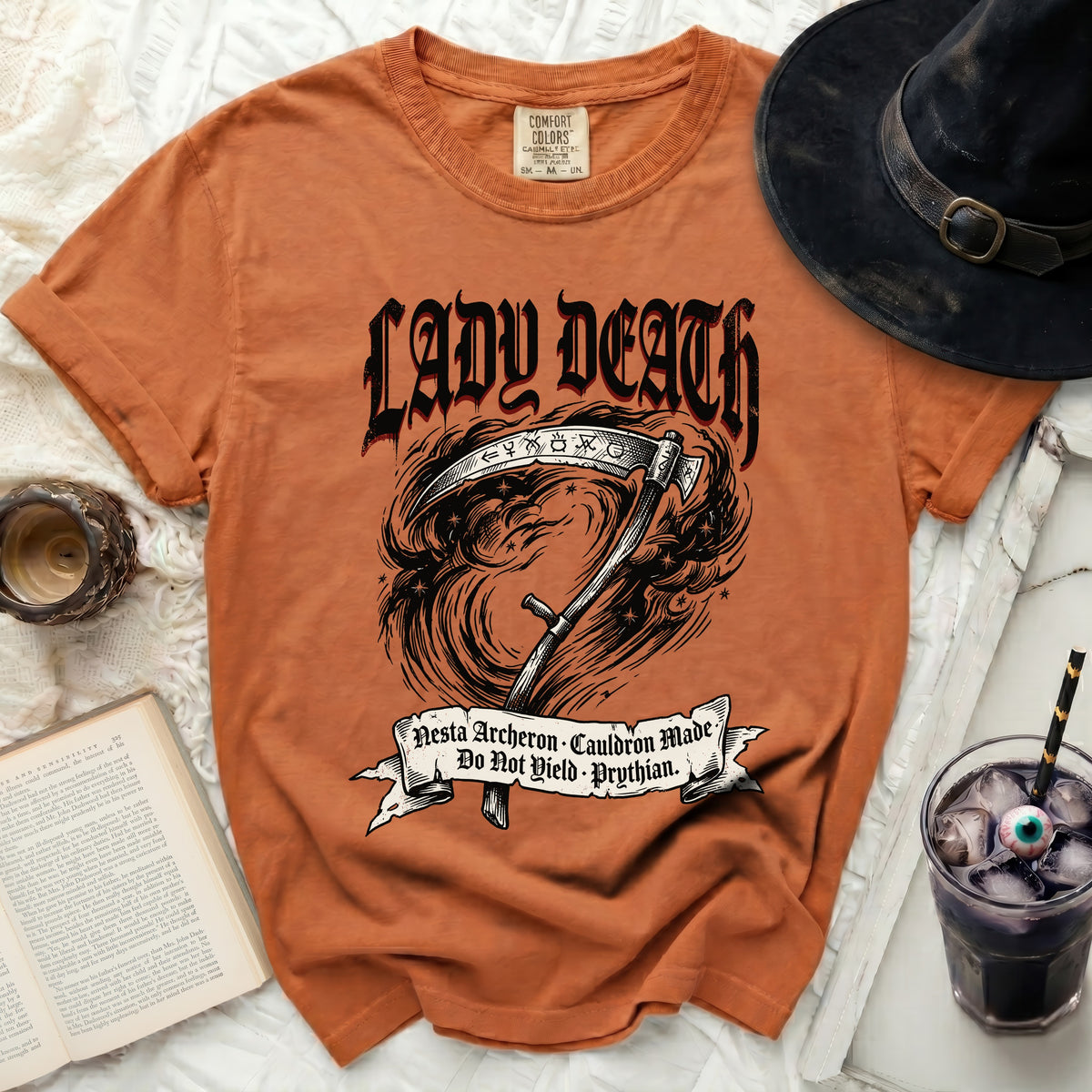 Orange t-shirt with "Lady Death" and scythe graphic, text reads "Nesta Archeron".