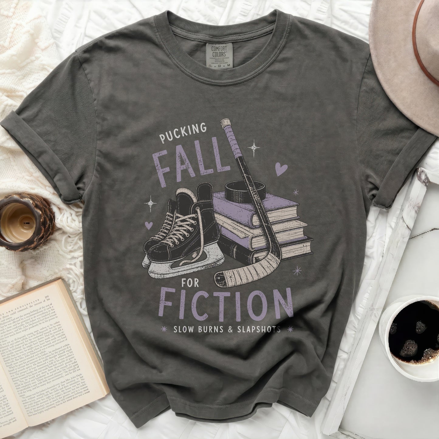 Dark grey t-shirt with "Pucking Fall Fiction" graphic and hockey imagery.