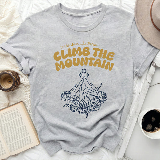 To the Stars Who Listen Climb the Mountain product type
Stars shirt
Mountain design
Listen quote
Climb apparel
Bookish fashion
Fantasy inspired
ACOTAR fan
Rhysand shirt
Fae kingdom
Roses thorns
Dragon wing art
Celestial graphic
Inspirational tee
Unique garment
Reading outfit
Literary gift
Mythical print
Adventure wear
Magic theme
Storytelling top