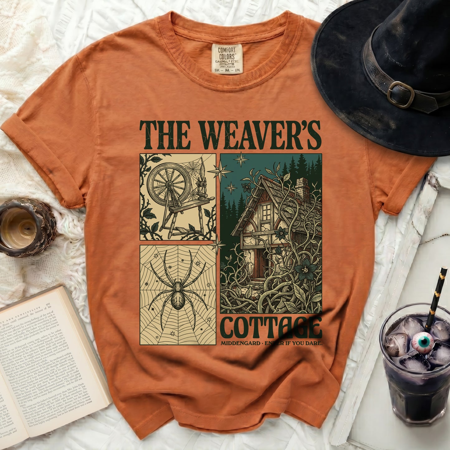 Orange t-shirt with "The Weaver's Cottage" text and graphics.