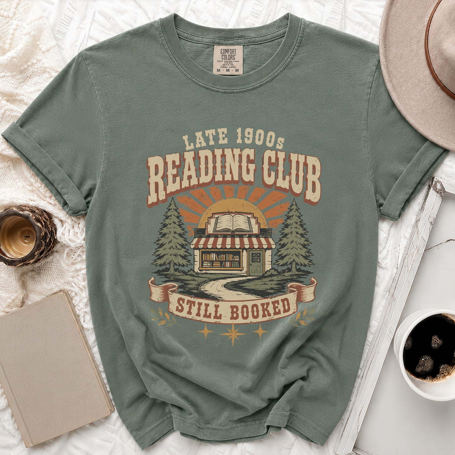 T-shirt with "Late 1900s Reading Club Still Booked" graphic and bookstore illustration.