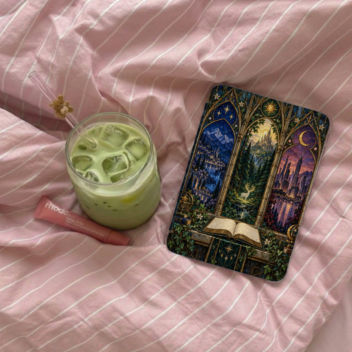 Open book with ornate stained glass scenes of castles, forests, and cities.