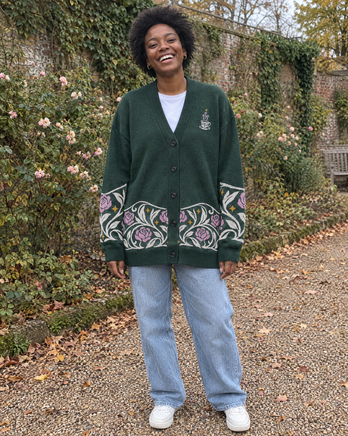 The Suriel Tarot Knitted Cardigan in an autumn garden