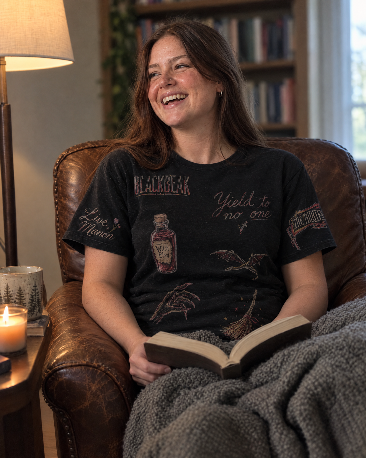 Manon and the Thirteen Doodles Tee, reading in an armchair