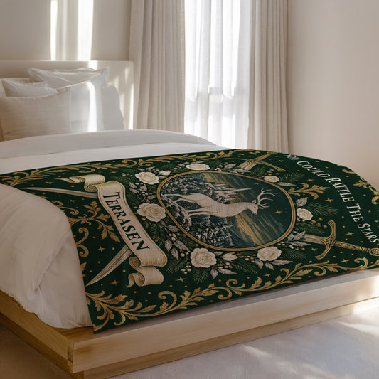 Terrasen Crest Velveteen Plush Blanket on a bed