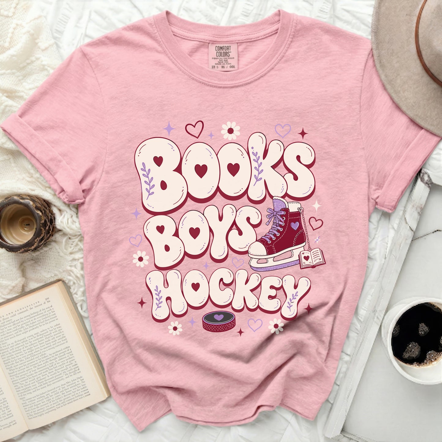 Pink t-shirt with "Books Boys Hockey" graphic and roller skate.