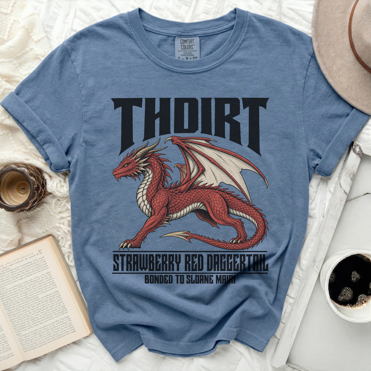 Blue t-shirt with red dragon graphic and text THOIRT, STRAWBERRY RED DAGGERTAIL, BONDED TO SLOANE MAIRI.