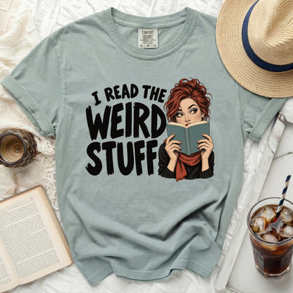 T-shirt with graphic reading "I READ THE WEIRD STUFF" featuring a woman reading a book.