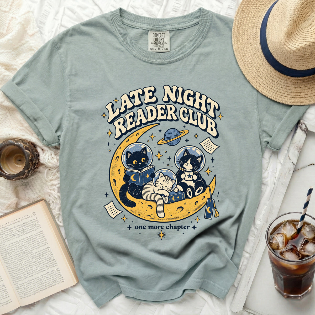 Light blue t-shirt with "Late Night Reader Club" text and cats in space.