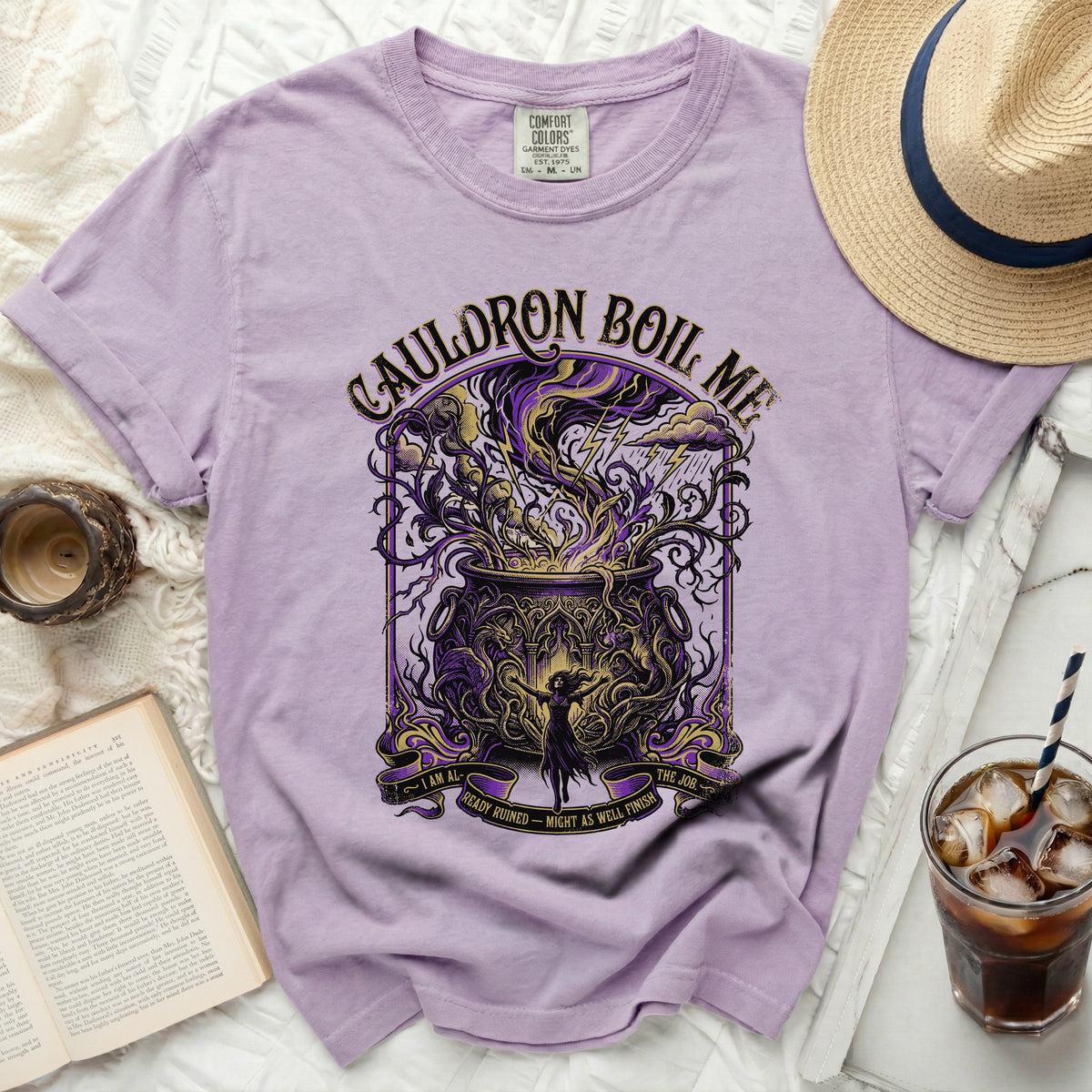 Purple t-shirt with "Cauldron Boil Me" and witch graphic.